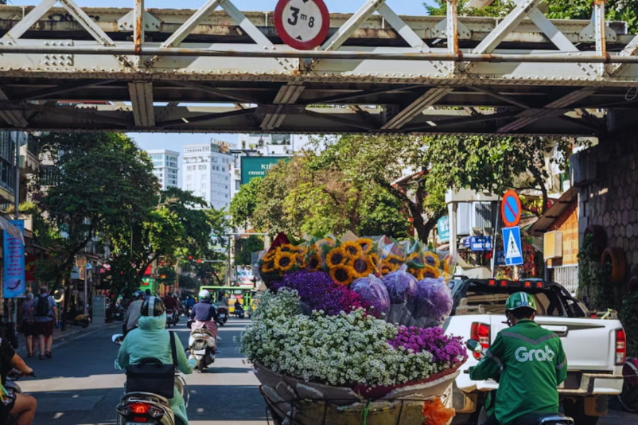 Solo travel Vietnam exploring Hanoi flower street and daily city life
